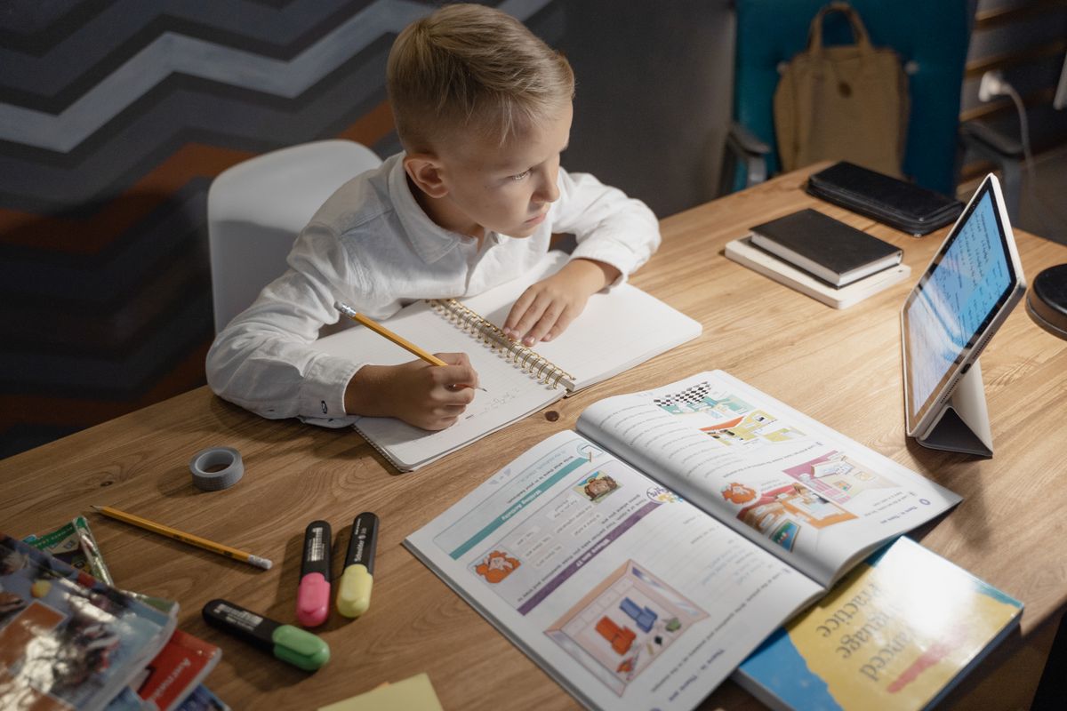 Child studying at a cozy home desk
